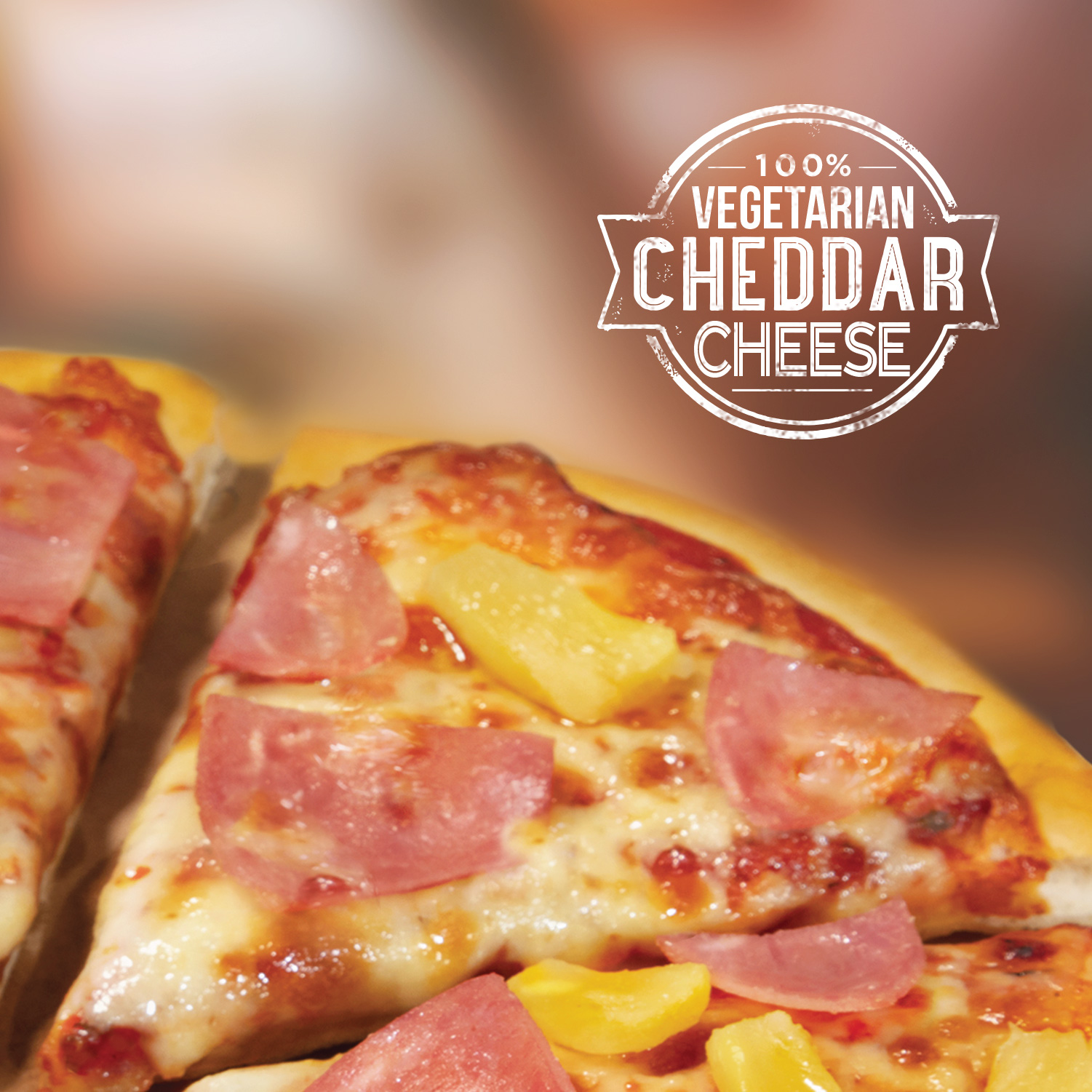 Hawaiian pizza with 100% vegetarian cheddar cheese stamp